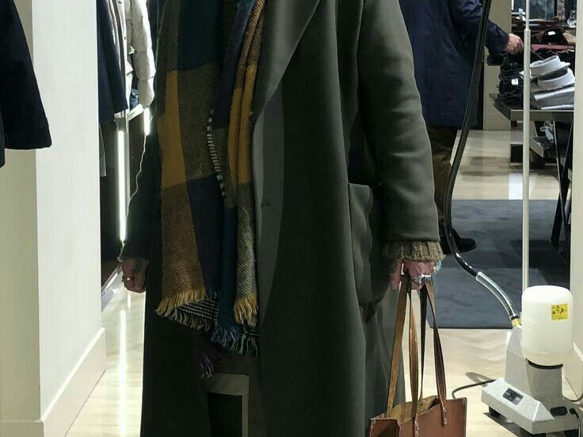 Tall man in a long coat for a tall men's dressing guide